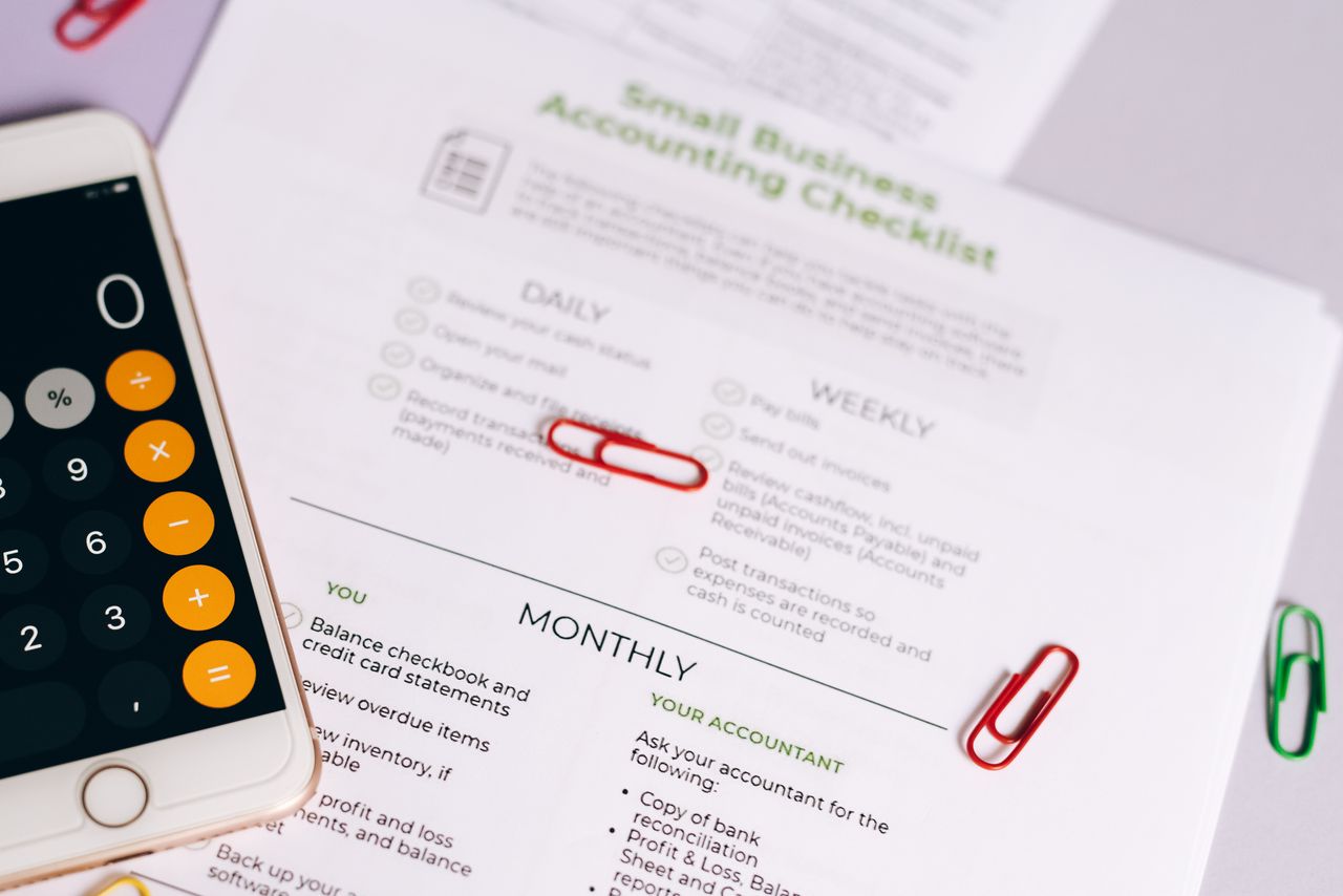Accounting checklist and calculator on a phone