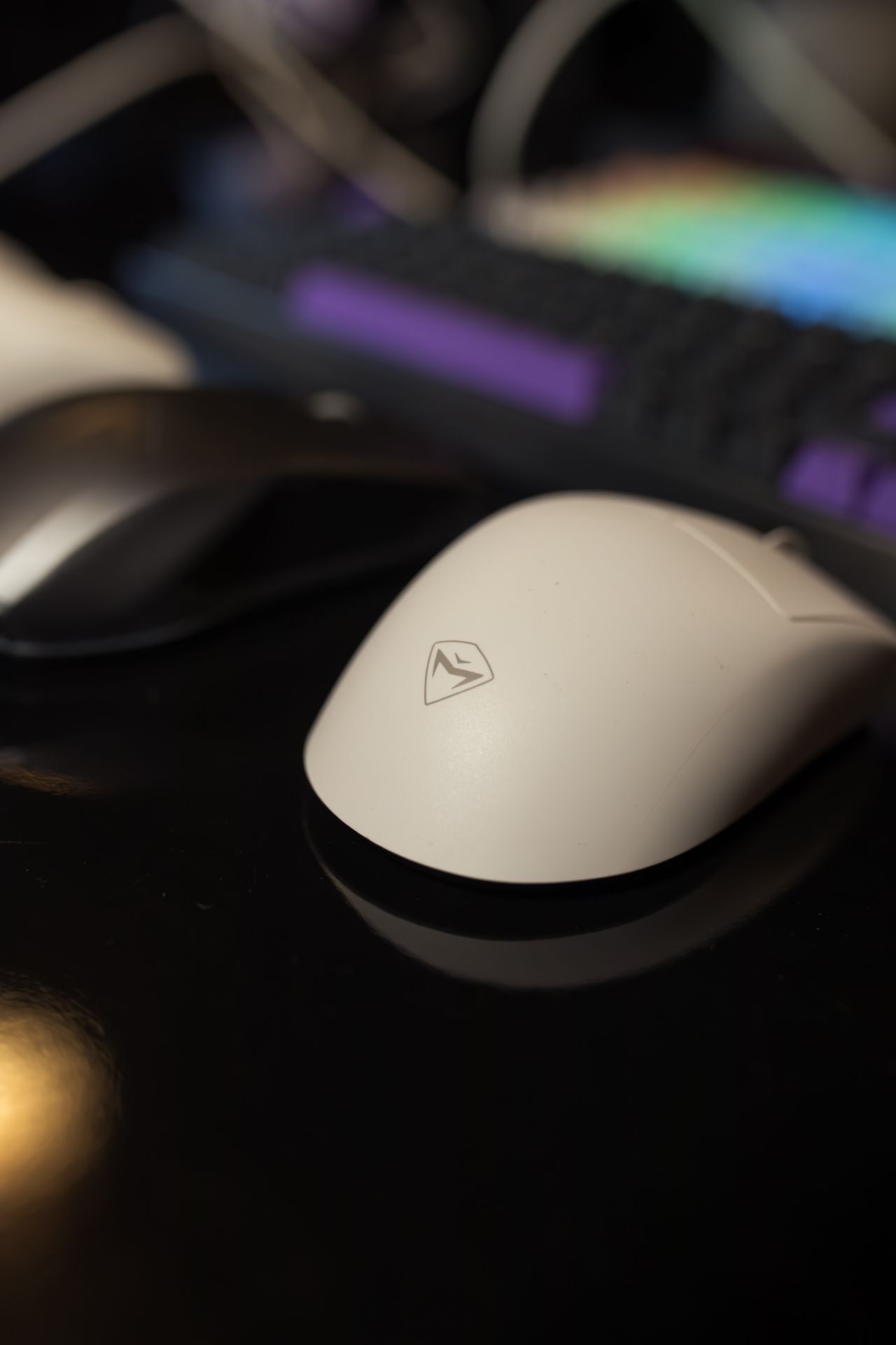 Close-up of a computer mouse beside a keyboard